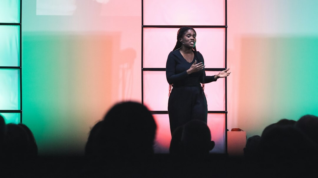 person giving speech on stage